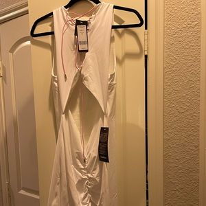 Bebe white sleeveless backless dress with pink laces in back. NWT.